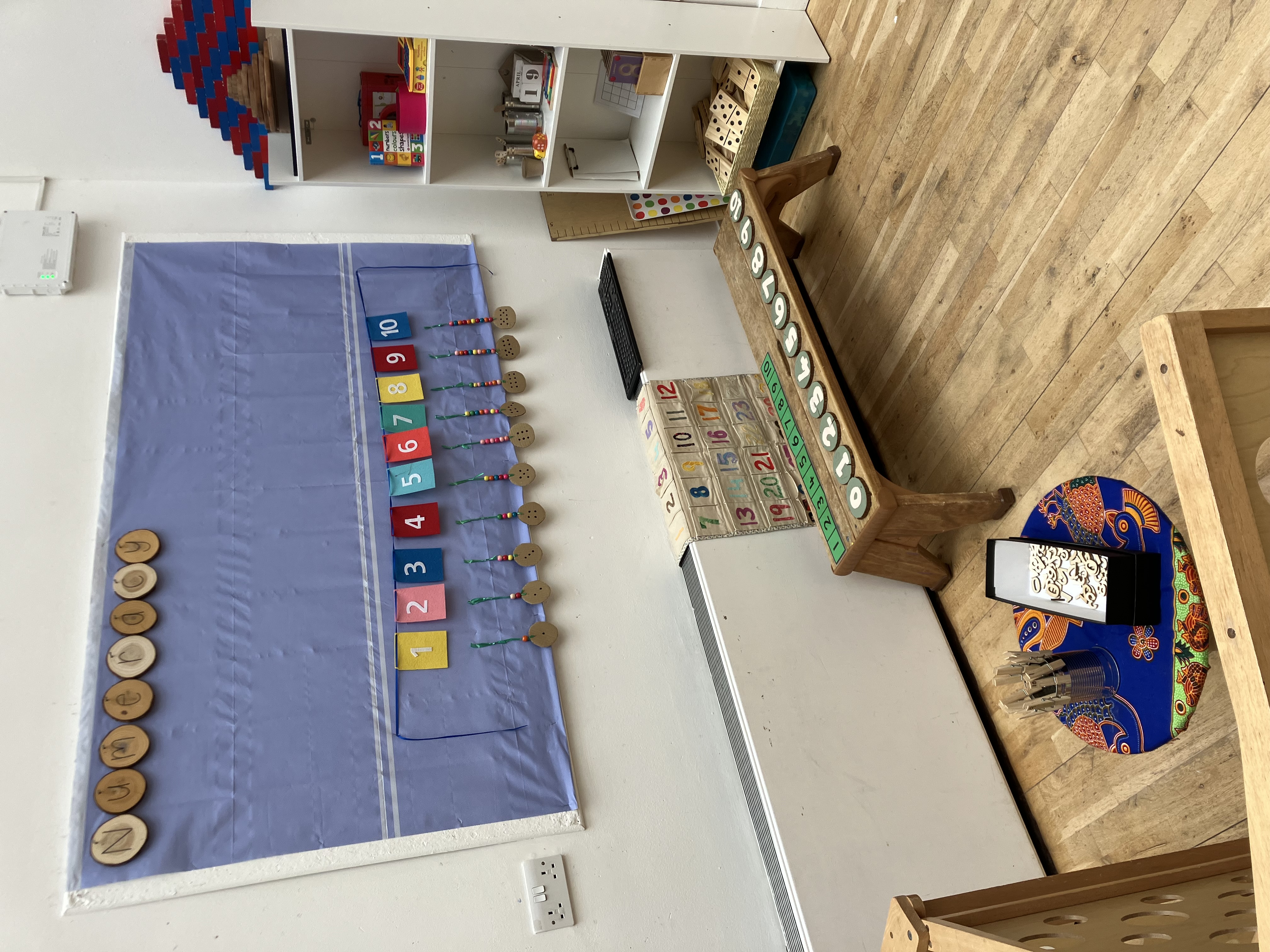 Number and maths learning resources laid out at Greenbank Preschool