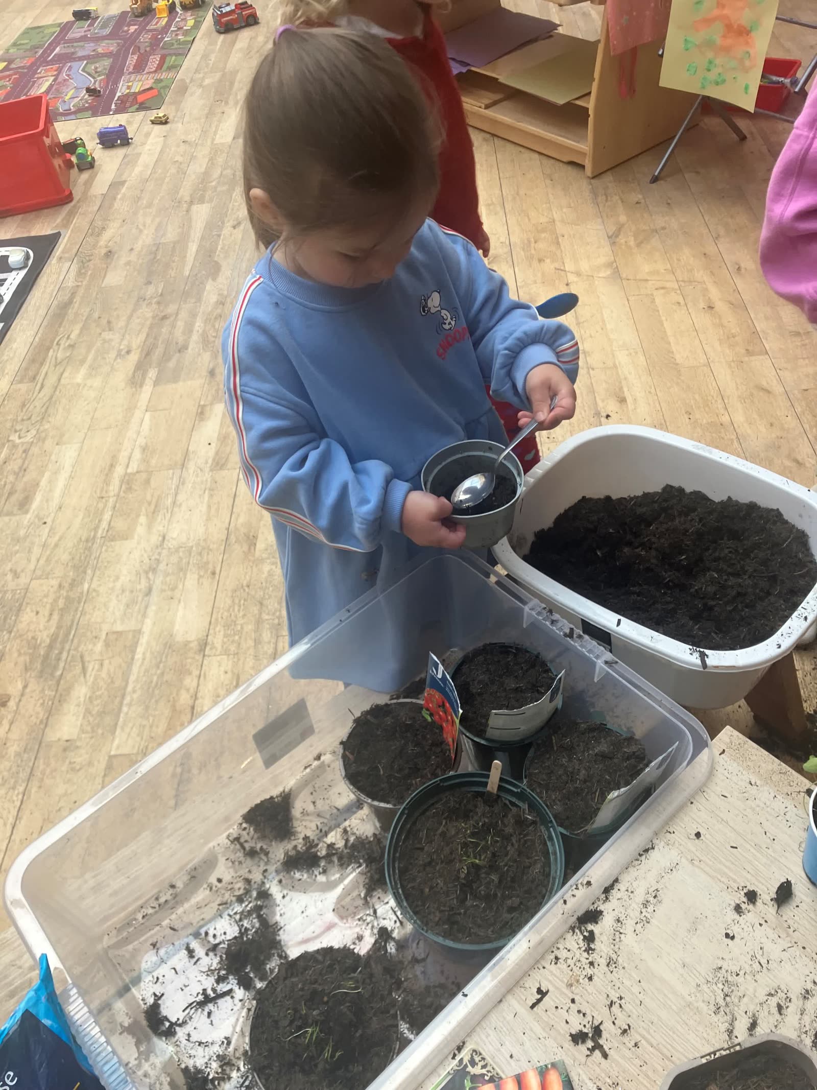 A child potting soil for the Pocket Picnic Garden